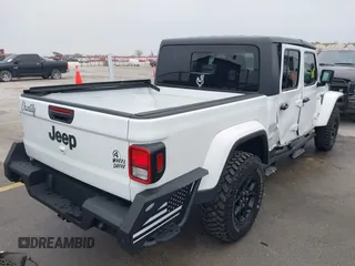 2021 Jeep Gladiator Willys with VIN 1C6HJTAG1ML575474, listed as a IAAI auction lot 41439898 with 44,335 mi miles and . Bid and sale history available at DreamBid. Image 4.