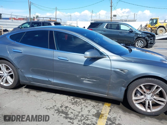 2014 Tesla Model S 60 with VIN 5YJSA1S15EFP29010, listed as a IAAI auction lot 41798180 with 142,754 mi miles and . Bid and sale history available at DreamBid. Image 6.