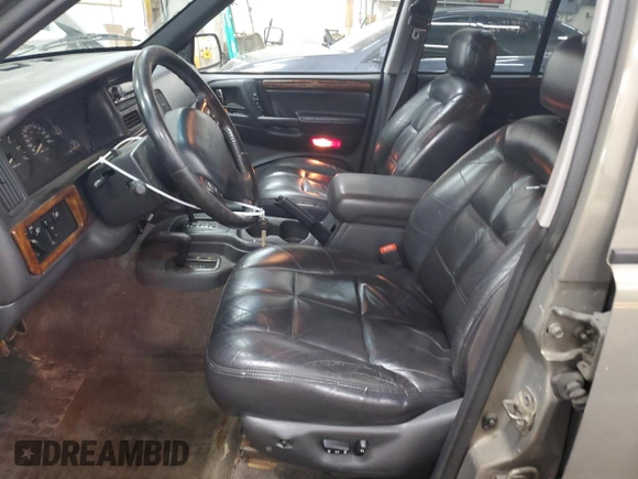 1996 Jeep Grand Cherokee Limited z VIN 1J4GZ78S5TC210710, wystawiony jako Copart lot #81307904 z przebiegiem 285 169 mil mil oraz Szkoda całkowita • Salvage title. Historia ofert i sprzedaży dostępna na DreamBid. Obrazek 7.