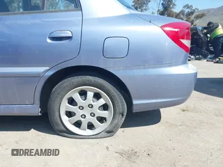 2005 Kia Rio with VIN KNADC125356385613, listed as a IAAI auction lot 41841381 with 91,273 mi miles. Bid and sale history available at carsss.com. Image 6.