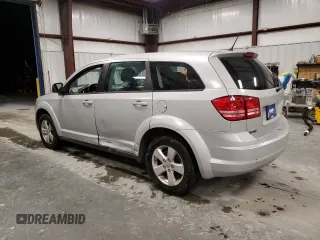 2013 Dodge Journey American Value z VIN 3C4PDCAB9DT536846, wystawiony jako Copart lot #86245174 z przebiegiem 162 677 mil mil oraz Szkoda całkowita • Salvage title. Historia ofert i sprzedaży dostępna na DreamBid. Obrazek 2.
