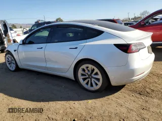 2021 Tesla Model 3 Standard Range Plus with VIN 5YJ3E1EA0MF017765, listed as a Copart auction lot 42776525 with 54,873 mi miles and Salvage Title. Bid and sale history available at carsss.com. Image 2.