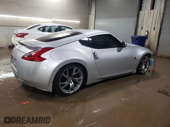 2014 Nissan 370Z Nismo with VIN JN1AZ4EH2EM636132, listed as a Copart auction lot 87218744 with 39,254 mi miles and Salvage Title. Bid and sale history available at DreamBid. Image 3.