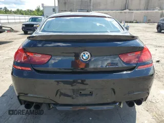 2015 BMW M6 z VIN WBS6C9C50FD467779, wystawiony jako Copart lot #56702794 z przebiegiem 78 259 mil mil oraz Szkody całkowita. Historia ofert i sprzedaży dostępna na DreamBid. Obrazek 6.