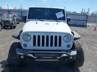 2014 Jeep Wrangler Unlimited Sahara with VIN 1C4BJWEG6EL203866, listed as a IAAI auction lot 41846091 with 105,296 mi miles. Bid and sale history available at carsss.com. Image 12.