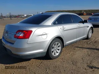 2011 Ford Taurus SE with VIN 1FAHP2DWXBG172965, listed as a IAAI auction lot 41395638 with 147,098 mi miles. Bid and sale history available at carsss.com. Image 4.