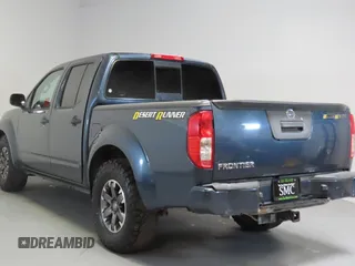 2014 Nissan Frontier SV with VIN 1N6AD0ERXEN763554, listed as a Copart auction lot 64313295 with 109,756 mi miles and Salvage title. Bid and sale history available at DreamBid. Image 4.