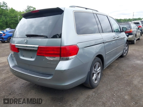 2008 Honda Odyssey Touring with VIN 5FNRL38908B066127, listed as a IAAI auction lot 42219444 with 188,868 mi miles and . Bid and sale history available at DreamBid. Image 4.