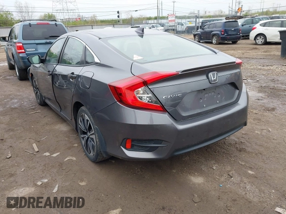 2017 Honda Civic EX-T with VIN 19XFC1F34HE014334, listed as a IAAI auction lot 42009311 with 124,717 mi miles. Bid and sale history available at carsss.com. Image 3.