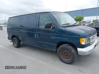 1998 Ford Econoline Cargo with VIN 1FTRE1426WHB06957, listed as a IAAI auction lot 42071927 with 99,999 mi miles. Bid and sale history available at carsss.com. Image 1.