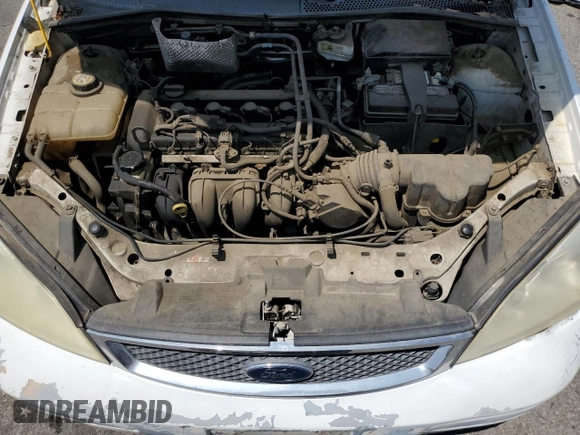 2007 Ford Focus S z VIN 1FAFP34NX7W106482, wystawiony jako Copart lot #57675245 z przebiegiem 170 237 mil mil oraz Szkoda całkowita • Salvage title. Historia ofert i sprzedaży dostępna na DreamBid. Obrazek 11.