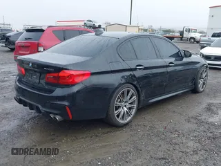 2018 BMW 5 Series M550i xDrive with VIN WBAJB9C59JB049114, listed as a IAAI auction lot 41543633 with 87,942 mi miles and . Bid and sale history available at carsss.com. Image 4.