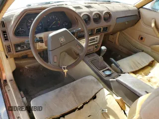 1982 Datsun 280ZX 2+2 z VIN JN1HZ06S8CX428785, wystawiony jako Copart lot #80942274 z przebiegiem 88 574 mil mil oraz Tytuł czysty. Historia ofert i sprzedaży dostępna na DreamBid. Obrazek 8.