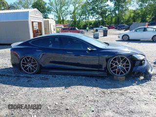 2015 Tesla Model S 85D with VIN 5YJSA4H47FF083005, listed as a IAAI auction lot 40970624 with 84,327 mi miles. Bid and sale history available at carsss.com. Image 14.