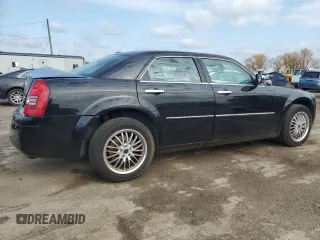 2009 Chrysler 300 with VIN 2C3LK33V19H614083, listed as a Copart auction lot 77529014 with 188,125 mi miles and Salvage title. Bid and sale history available at DreamBid. Image 3.