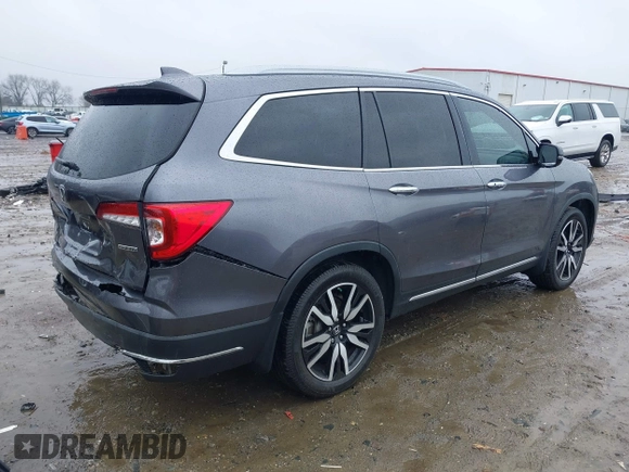 2021 Honda Pilot Touring 8-Passenger with VIN 5FNYF5H9XMB014190, listed as a IAAI auction lot 41749586 with 67,602 mi miles and . Bid and sale history available at DreamBid. Image 4.