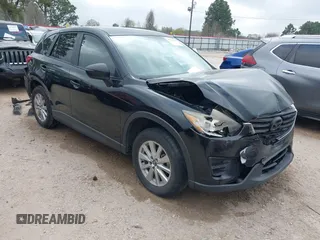 2016 Mazda CX-5 Sport with VIN JM3KE2BY1G0695938, listed as a IAAI auction lot 41792692 with 206,830 mi miles. Bid and sale history available at carsss.com. Image 1.