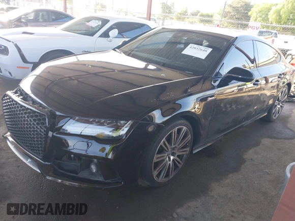 2015 Audi A7 Prestige with VIN WAU2GAFC2FN029875, listed as a IAAI auction lot 42032648 with 116,588 mi miles and . Bid and sale history available at DreamBid. Image 2.