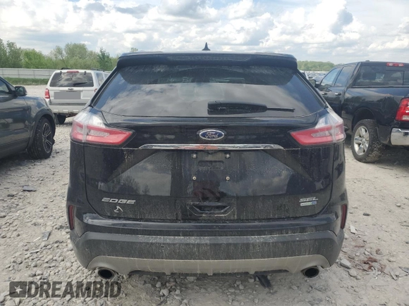 2020 Ford Edge SEL z VIN 2FMPK4J95LBB04706, wystawiony jako Copart lot #56948215 z przebiegiem 69 376 mil mil oraz Czysty tytuł • Clean title. Historia ofert i sprzedaży dostępna na DreamBid. Obrazek 6.