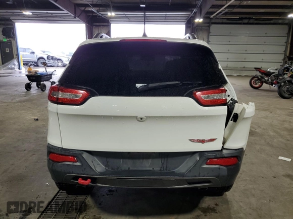 2016 Jeep Cherokee Trailhawk with VIN 1C4PJMBS8GW166629, listed as a Copart auction lot 55845415 with 122,290 mi miles and Salvage title. Bid and sale history available at DreamBid. Image 6.