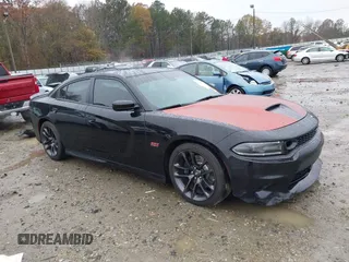 2021 Dodge Charger Scat Pack Widebody with VIN 2C3CDXGJ9MH643347, listed as a IAAI auction lot 41028032 with 76,615 mi miles. Bid and sale history available at carsss.com. Image 1.