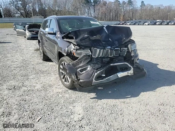 2017 Jeep Grand Cherokee Overland with VIN 1C4RJECG2HC712823, listed as a Copart auction lot 48063325 with 124,812 mi miles and Salvage Title. Bid and sale history available at carsss.com. Image 10.