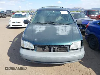 1998 Toyota Sienna LE with VIN 4T3ZF13CXWU049115, listed as a IAAI auction lot 42193159 with 194,313 mi miles and . Bid and sale history available at DreamBid. Image 6.