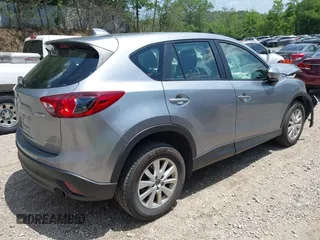 2014 Mazda CX-5 Sport with VIN JM3KE2BEXE0329303, listed as a IAAI auction lot 42556908 with 127,836 mi miles and . Bid and sale history available at DreamBid. Image 4.