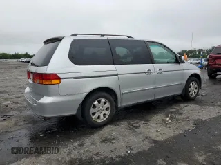 2003 Honda Odyssey EX z VIN 5FNRL18603B008148, wystawiony jako Copart lot #60669825 z przebiegiem 128 115 mil mil oraz Czysty tytuł • Clean title. Historia ofert i sprzedaży dostępna na DreamBid. Obrazek 3.