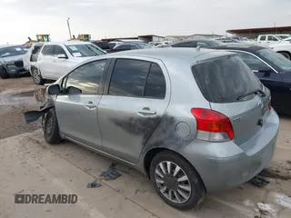 2010 Toyota Yaris with VIN JTDKT4K33A5314776, listed as a IAAI auction lot 41570383 with 167,428 mi miles. Bid and sale history available at carsss.com. Image 3.