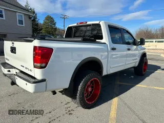 2015 Nissan Titan SL with VIN 1N6BA0EC7FN509763, listed as a Copart auction lot 88064785 with 168,916 mi miles and Clean Title. Bid and sale history available at carsss.com. Image 3.