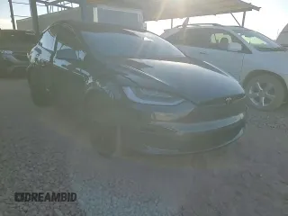 2023 Tesla Model X with VIN 7SAXCAE5XPF384061, listed as a Copart auction lot 86834084 with 6,974 mi miles and Salvage Title. Bid and sale history available at DreamBid. Image 11.
