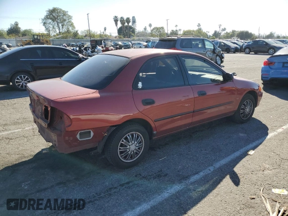 1998 Mazda Protege DX z VIN JM1BC1411W0198007, wystawiony jako Copart lot #46941185 z przebiegiem 101 696 mil mil oraz Szkoda całkowita • Salvage title. Historia ofert i sprzedaży dostępna na DreamBid. Obrazek 3.