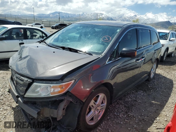 2012 Honda Odyssey Touring with VIN 5FNRL5H97CB070213, listed as a Copart auction lot 53558715 with 218,964 mi miles and Salvage title. Bid and sale history available at DreamBid. Image 1.