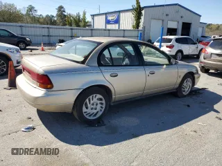 1999 Saturn SL с VIN 1G8ZK527XXZ111390, выставлен на аукционе Copart как лот 49042185 с пробегом 164 733 миль миль и Списание • Salvage title. История ставок и продаж доступна на DreamBid. Изображение 3.