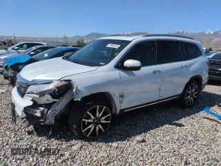 2020 Honda Pilot Touring 8-Passenger z VIN 5FNYF6H91LB001378, wystawiony jako Copart lot #57902075 z przebiegiem 111 994 mil mil oraz Szkoda całkowita • Salvage title. Historia ofert i sprzedaży dostępna na DreamBid. Obrazek 1.