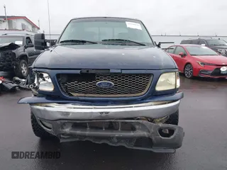 2003 Ford F-150 XLT with VIN 1FTRW08L33KC62060, listed as a IAAI auction lot 41618936 with 276,251 mi miles. Bid and sale history available at carsss.com. Image 12.