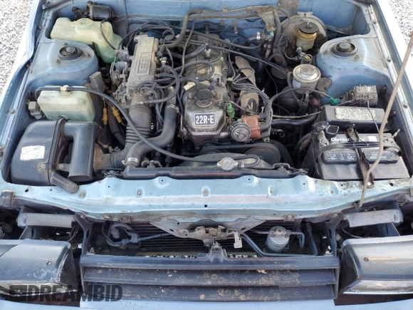 1983 Toyota Celica z VIN JT2RA64L7D6174381, wystawiony jako Copart lot #75986554 z przebiegiem 312 583 mil mil oraz Szkoda całkowita • Salvage title. Historia ofert i sprzedaży dostępna na DreamBid. Obrazek 11.
