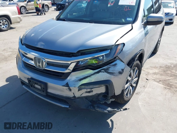 2020 Honda Pilot EX-L with VIN 5FNYF5H46LB004744, listed as a IAAI auction lot 42095298 with 76,159 mi miles and . Bid and sale history available at DreamBid. Image 6.