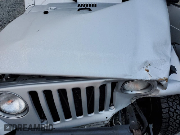 2006 Jeep Wrangler Unlimited LWB with VIN 1J4FA44S66P757473, listed as a Copart auction lot 50405835 with 143,685 mi miles and Salvage Title. Bid and sale history available at carsss.com. Image 12.