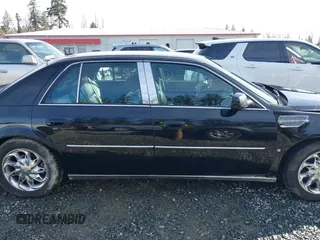 2006 Cadillac DTS 1SC z VIN 1G6KD57YX6U100634, wystawiony jako IAAI lot #41671007 z przebiegiem Nie podano mil oraz . Historia ofert i sprzedaży dostępna na DreamBid. Obrazek 13.