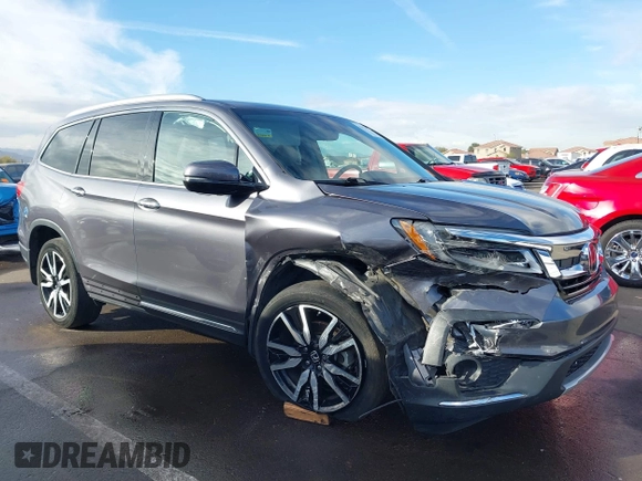 2019 Honda Pilot Touring 7-Passenger z VIN 5FNYF5H65KB020420, wystawiony jako IAAI lot #41575972 z przebiegiem 48 950 mil mil oraz . Historia ofert i sprzedaży dostępna na DreamBid. Obrazek 6.