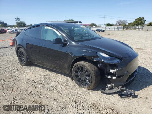 2023 Tesla Model Y Long Range with VIN 7SAYGAEE0PF642810, listed as a Copart auction lot 52181655 with 74,922 mi miles and Salvage Title. Bid and sale history available at DreamBid. Image 4.