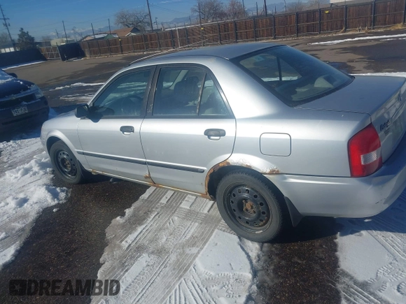 2002 Mazda Protege DX with VIN JM1BJ225321588015, listed as a IAAI auction lot 41409015 with 170,815 mi miles and . Bid and sale history available at DreamBid. Image 6.