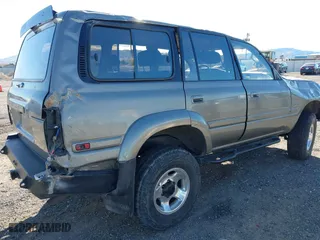 1997 Toyota Land Cruiser with VIN JT3HJ85JXV0174430, listed as a IAAI auction lot 41502690 with 300,632 mi miles. Bid and sale history available at carsss.com. Image 4.