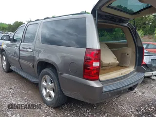 2011 Chevrolet Suburban LT with VIN 1GNSCJE03BR267184, listed as a IAAI auction lot 42156424 with 307,618 mi miles. Bid and sale history available at carsss.com. Image 3.