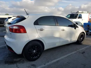 2015 Kia Rio LX with VIN KNADM5A39F6460207, listed as a Copart auction lot 44464245 with 106,792 mi miles and Salvage Title. Bid and sale history available at carsss.com. Image 3.