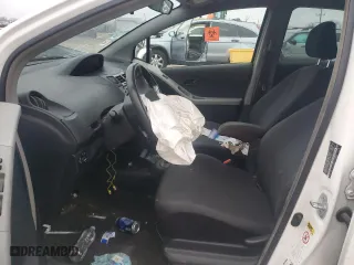 2009 Toyota Yaris with VIN JTDKT903495230252, listed as a Copart auction lot 82300464 with 0 mi miles and Salvage Title. Bid and sale history available at carsss.com. Image 7.
