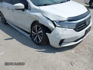 2021 Honda Odyssey Touring with VIN 5FNRL6H80MB010952, listed as a IAAI auction lot 42080412 with 90,594 mi miles and . Bid and sale history available at DreamBid. Image 6.