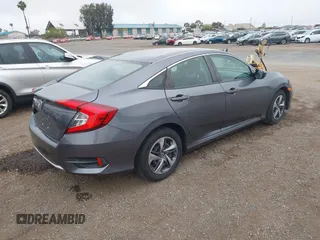 2020 Honda Civic LX with VIN 2HGFC2F63LH567698, listed as a IAAI auction lot 42354886 with 70,977 mi miles and . Bid and sale history available at DreamBid. Image 4.